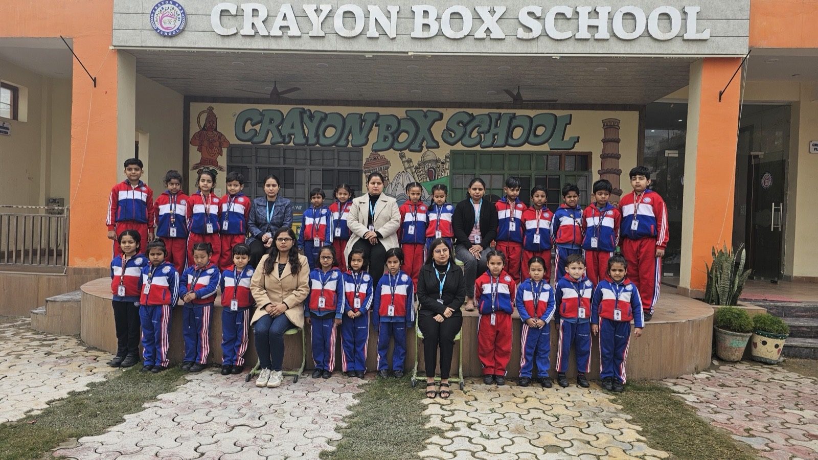 Smiling Crayon Box students in crisp school uniform