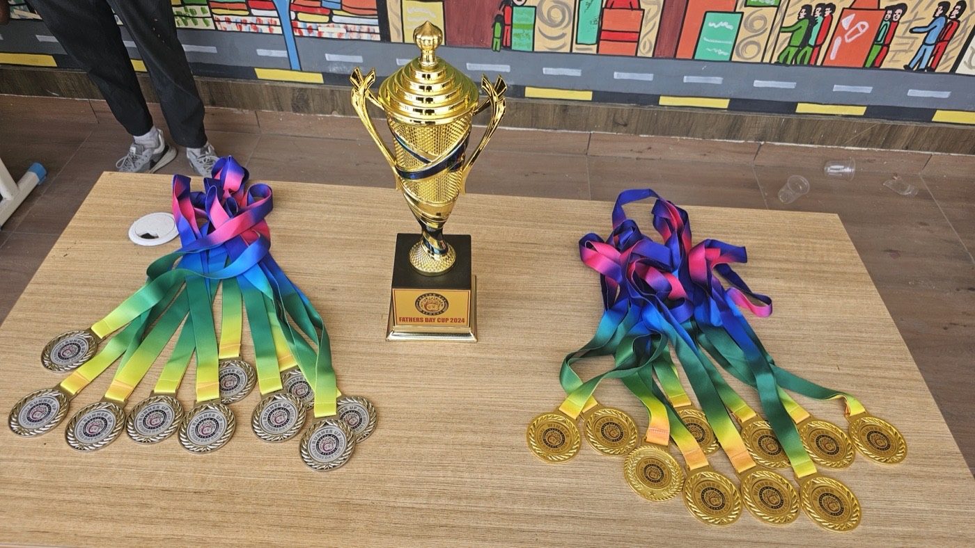 Father's Day Cup 2024 championship trophy and Crayon Box medals